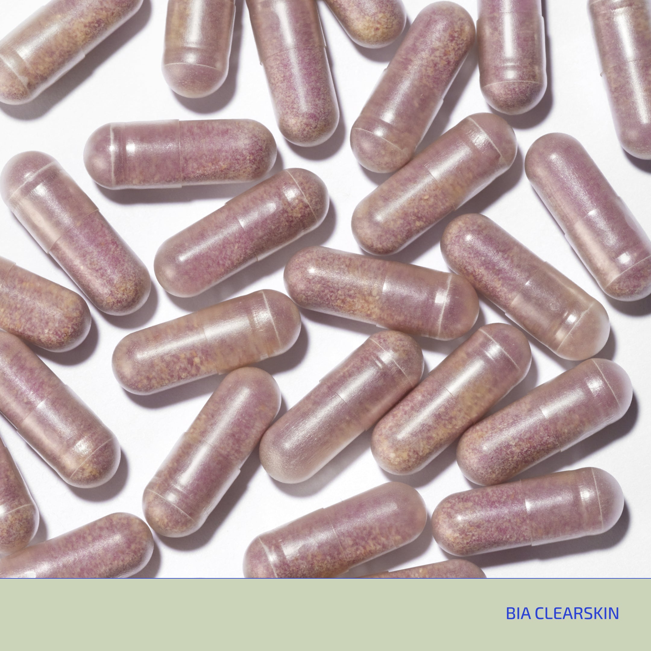 Purple capsules scattered on a white background with 'BIA CLEARSKIN' branding.